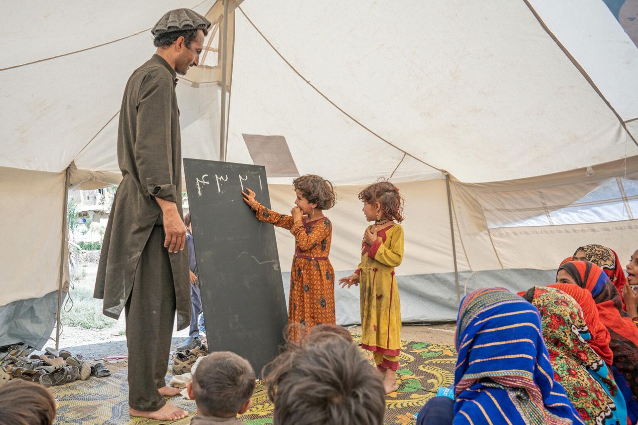 Survivors of June’s devastating earthquake attend class at a community-based education centre in Gayan District, Paktika Province, Afghanistan. ©UNICEF/UN0678771/Mark Naftalin