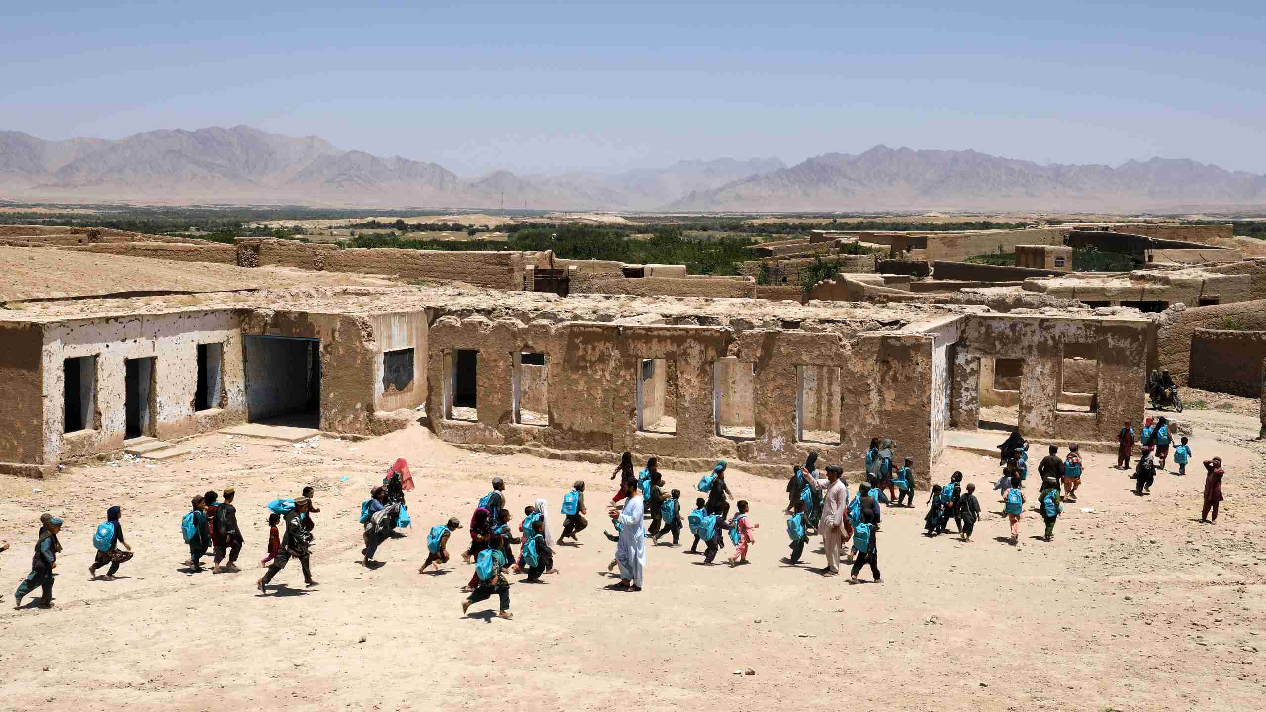 School children amongst ruins(Photo: NRC/Enayatullah Azad)