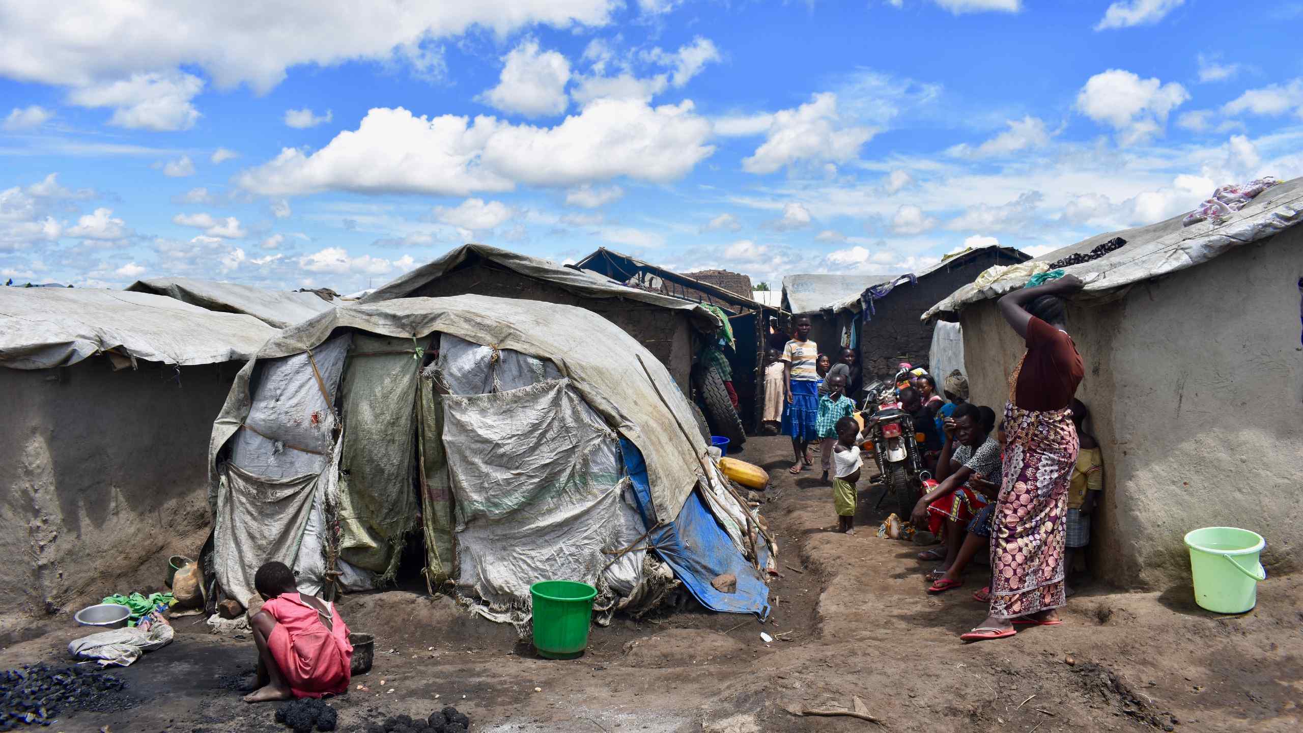 Internally displaced Congolese gather outside an IDP camp