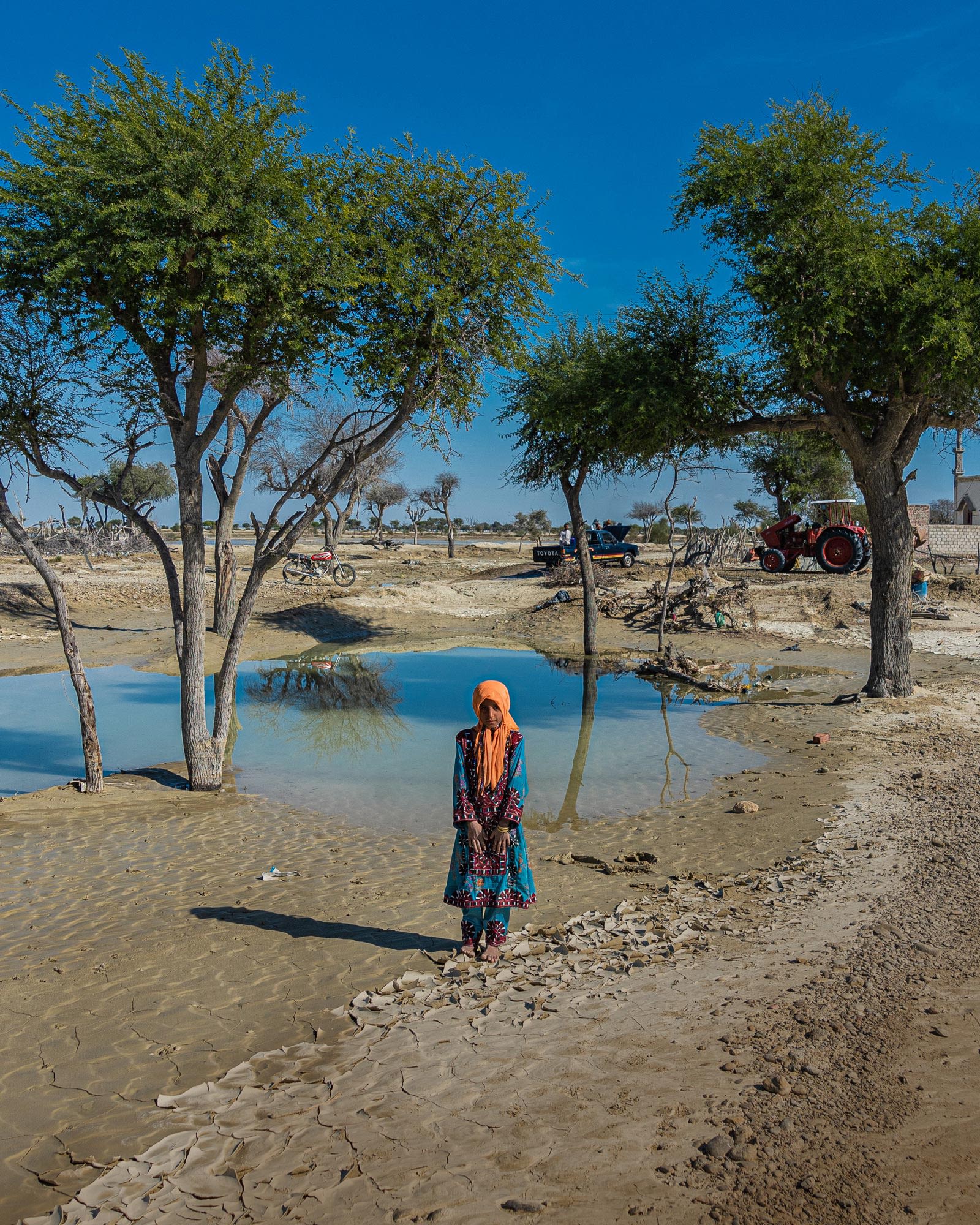 A girl stands near a submerged field after flash floods hit Zarabad and Dashtiari regions in Iran on January 20, 2020. (Reza Adeli / Anadolu Agency via Getty Images)